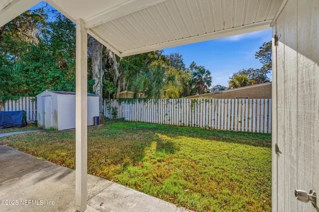a view of a porch with a backyard
