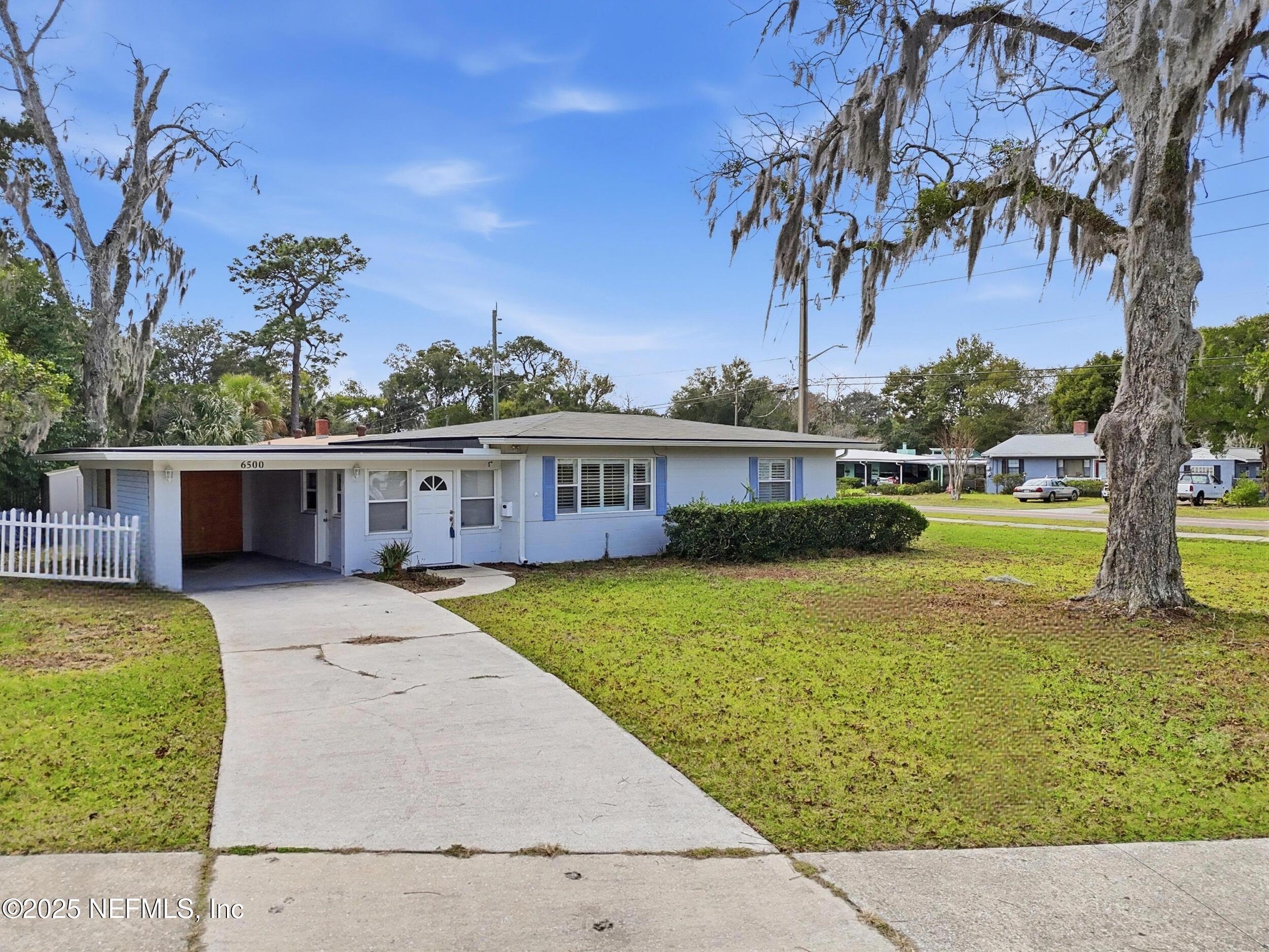6500 Altama Road Jacksonville, FL 32216 - Photo 3 of 30 a front view of a house with garden