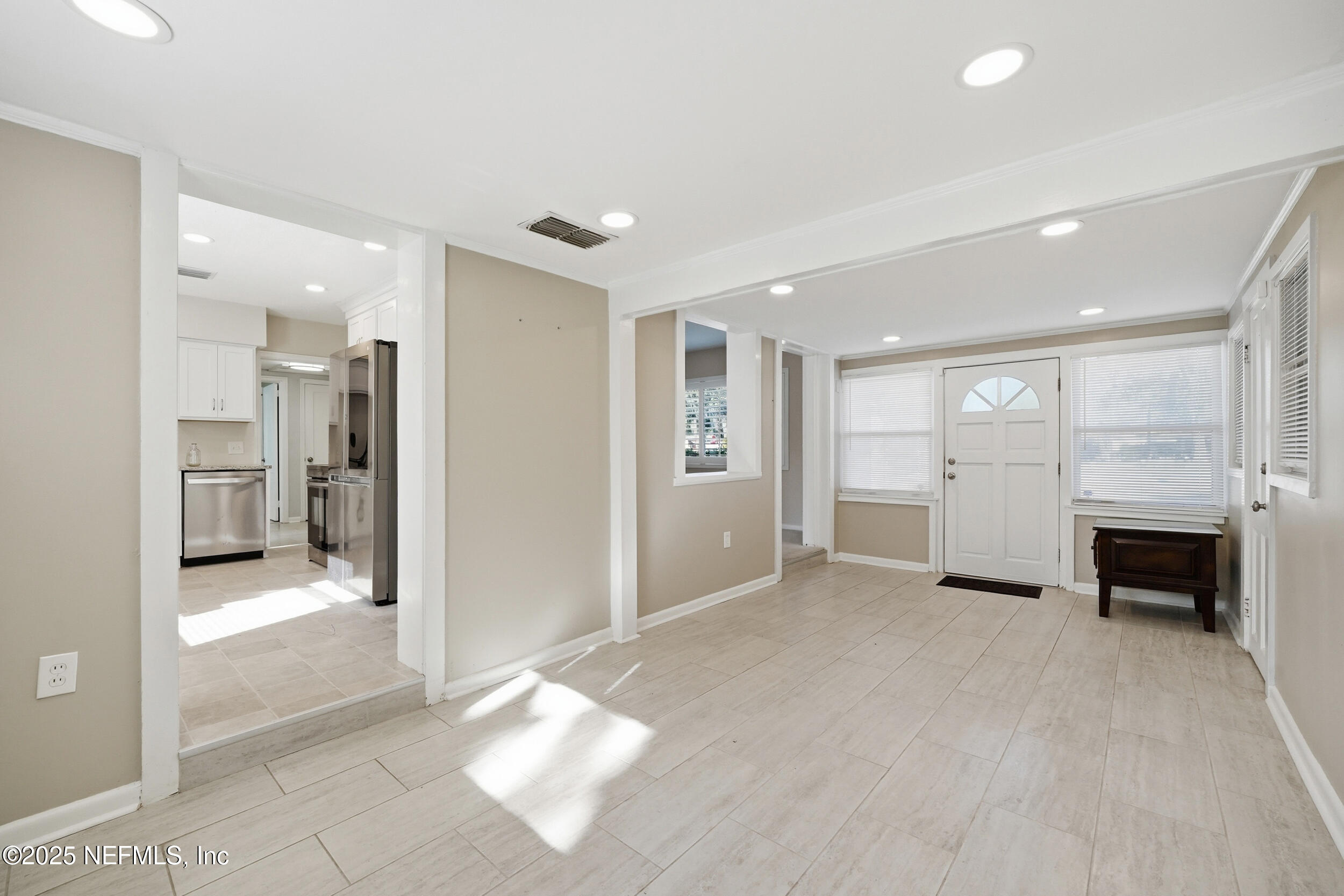 6500 Altama Road Jacksonville, FL 32216 - Photo 5 of 30 a view of a livingroom with a fireplace and window