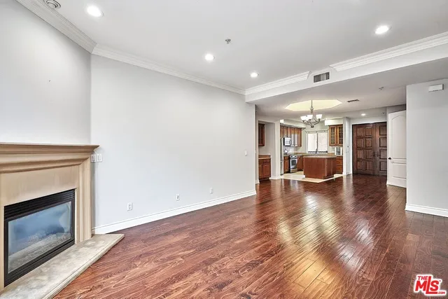 a view of a kitchen with a sink and a fireplace
