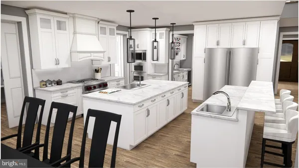 a kitchen with kitchen island granite countertop a sink stove and refrigerator