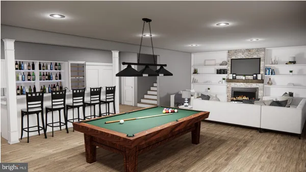 a room with furniture pool table flat screen tv and windows