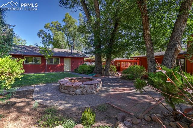 1404 West Cheyenne Road Colorado Springs, CO 80906 - Photo 48 of 50 View of patio featuring an outdoor fire pit