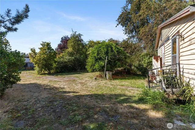 a backyard of a house with lots of green space