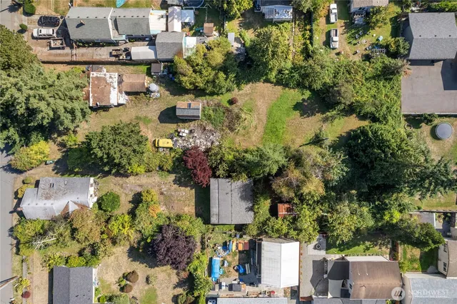 an aerial view of a house with a yard and garden
