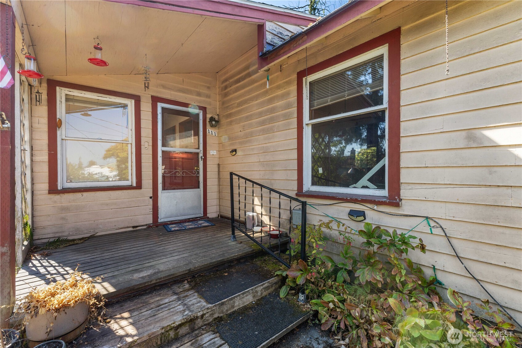 111 4th Avenue Southwest Pacific, WA 98047 - Photo 2 of 19 a view of a wooden door with a bench