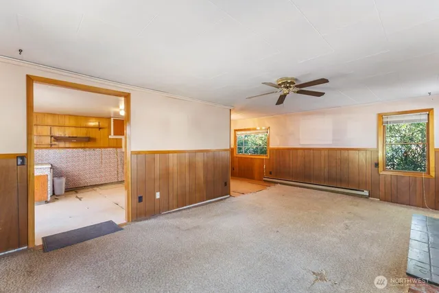 a view of an empty room and a window