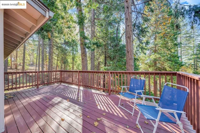 a view of a two chairs on the roof deck
