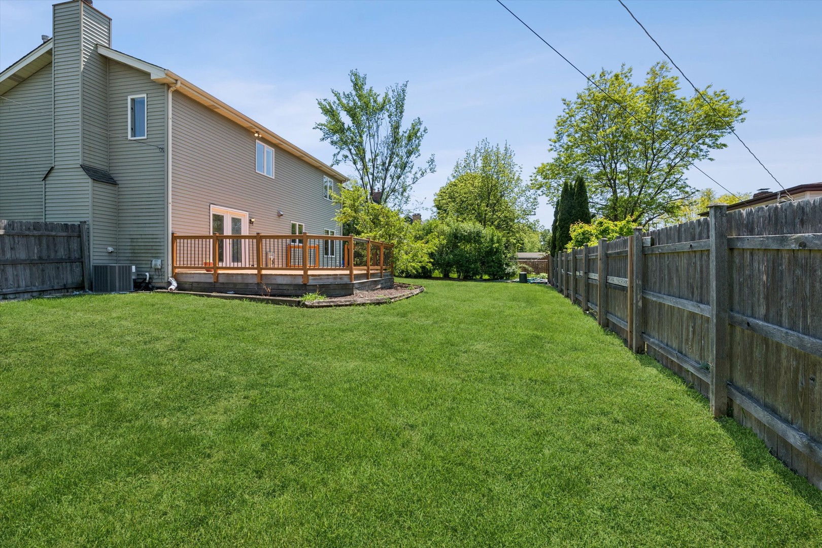 2142 North Summit Street Wheaton, IL 60187 - Photo 6 of 35 a front view of a house with a yard table and chairs