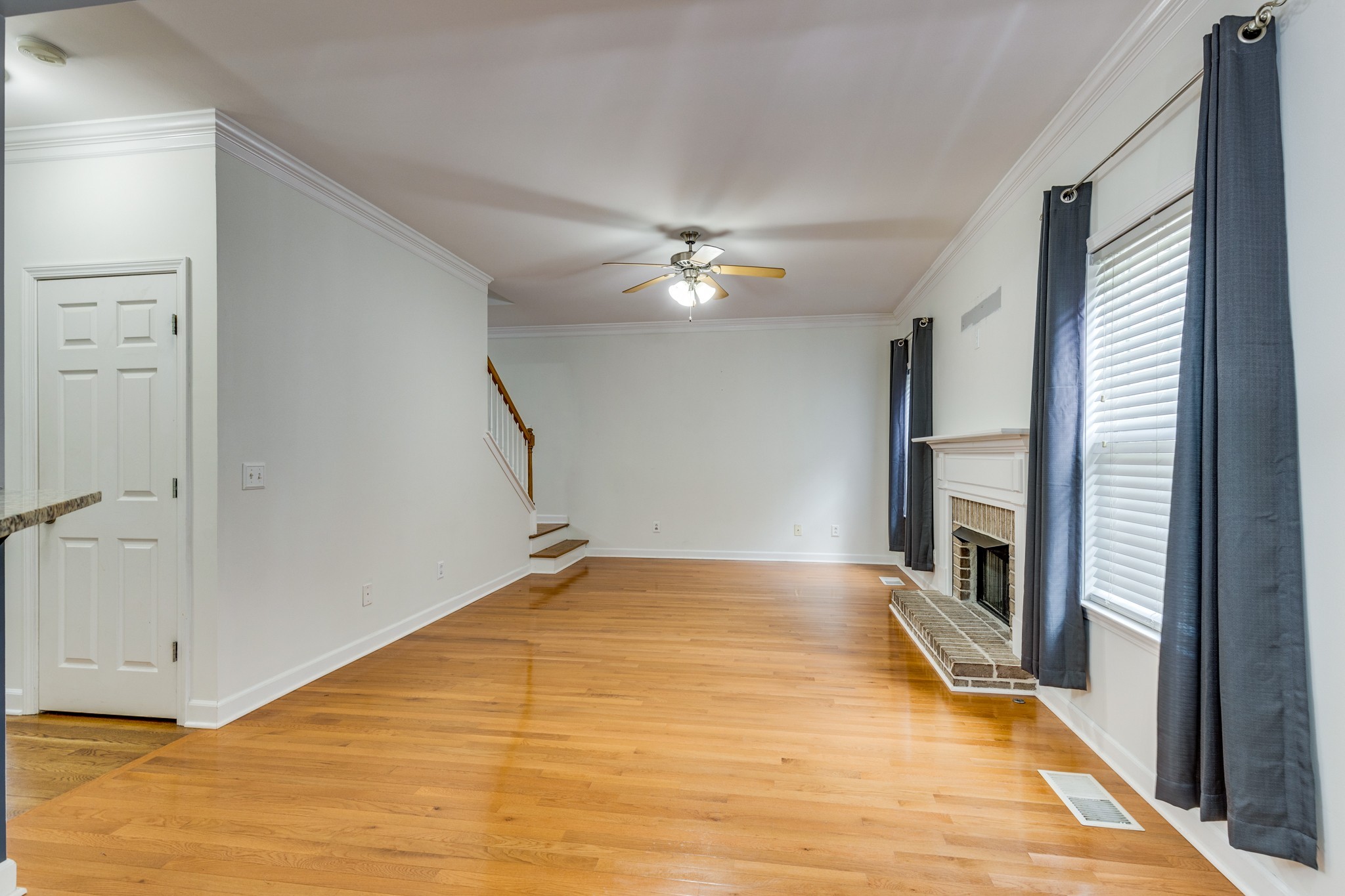 1024 Belcor Drive Spring Hill, TN 37174 - Photo 15 of 41 a view of an empty room with a fireplace and a window