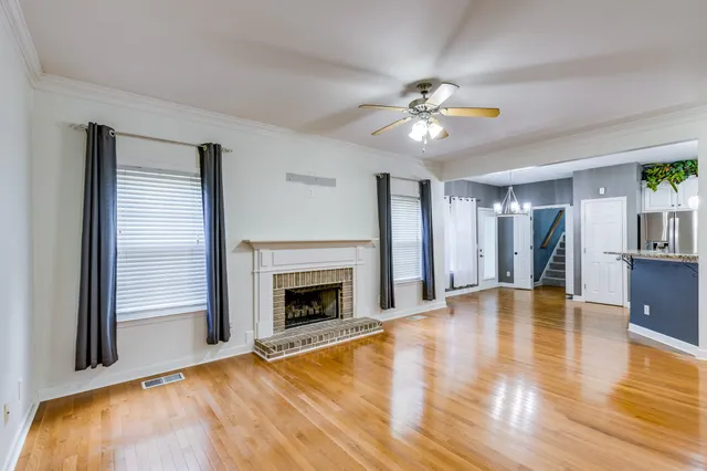 a kitchen with stainless steel appliances a refrigerator and a stove top oven
