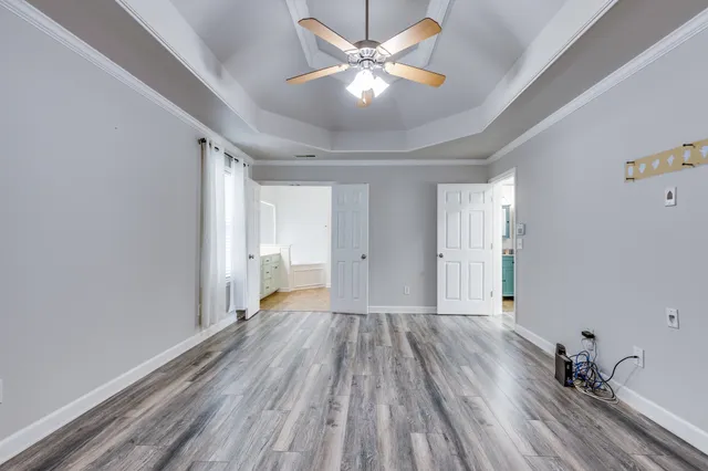 a bathroom with a tub sink and a mirror