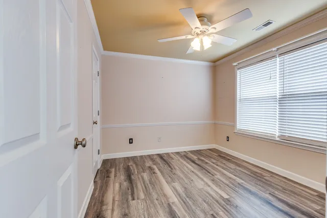 a room with furniture and wooden floor
