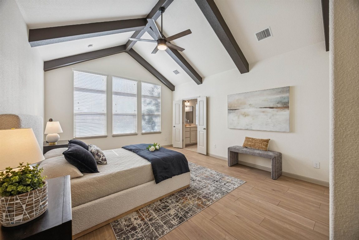 3329 Eagle Ridge Lane Pflugerville, TX 78660 - Photo 14 of 35 Bedroom featuring light wood finished floors, connected bathroom, and ceiling fan