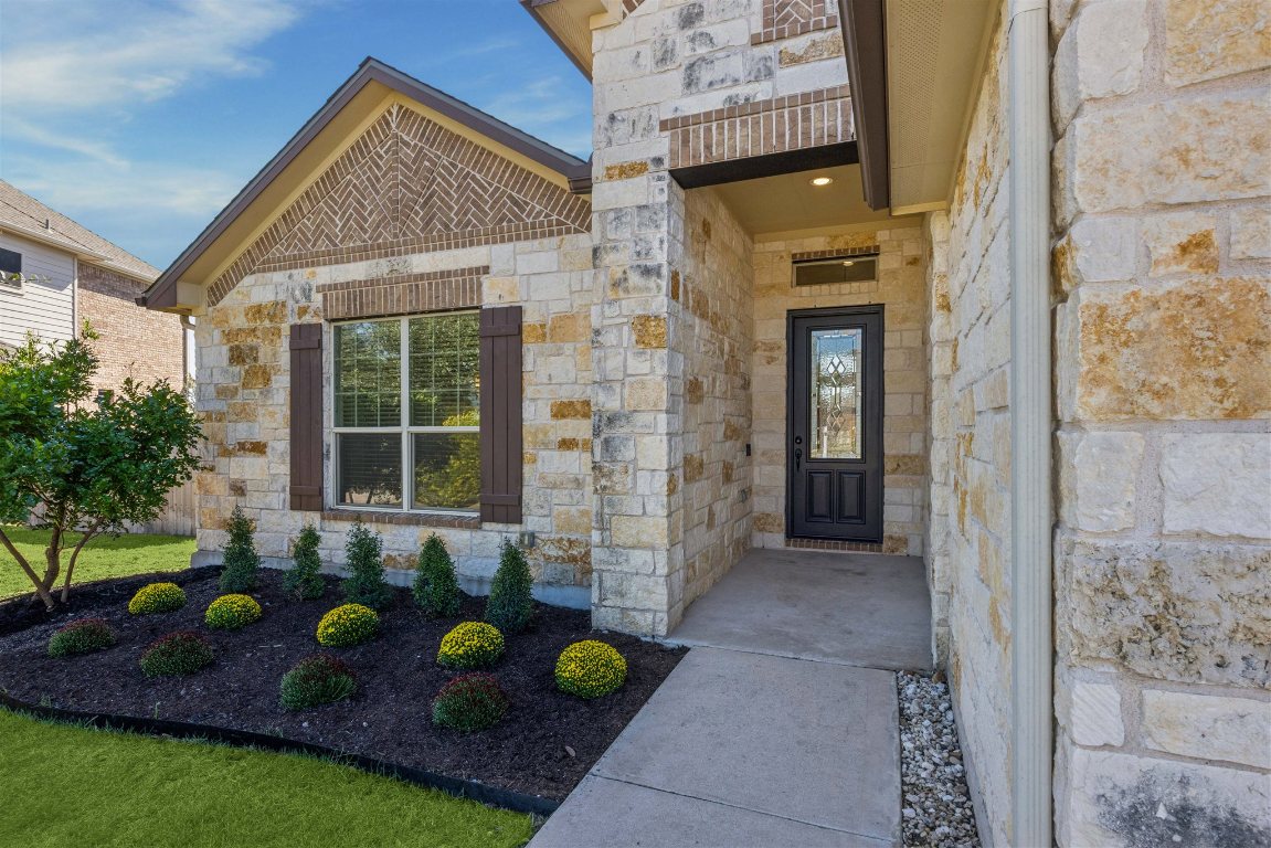 3329 Eagle Ridge Lane Pflugerville, TX 78660 - Photo 2 of 35 Entrance to property with stone siding