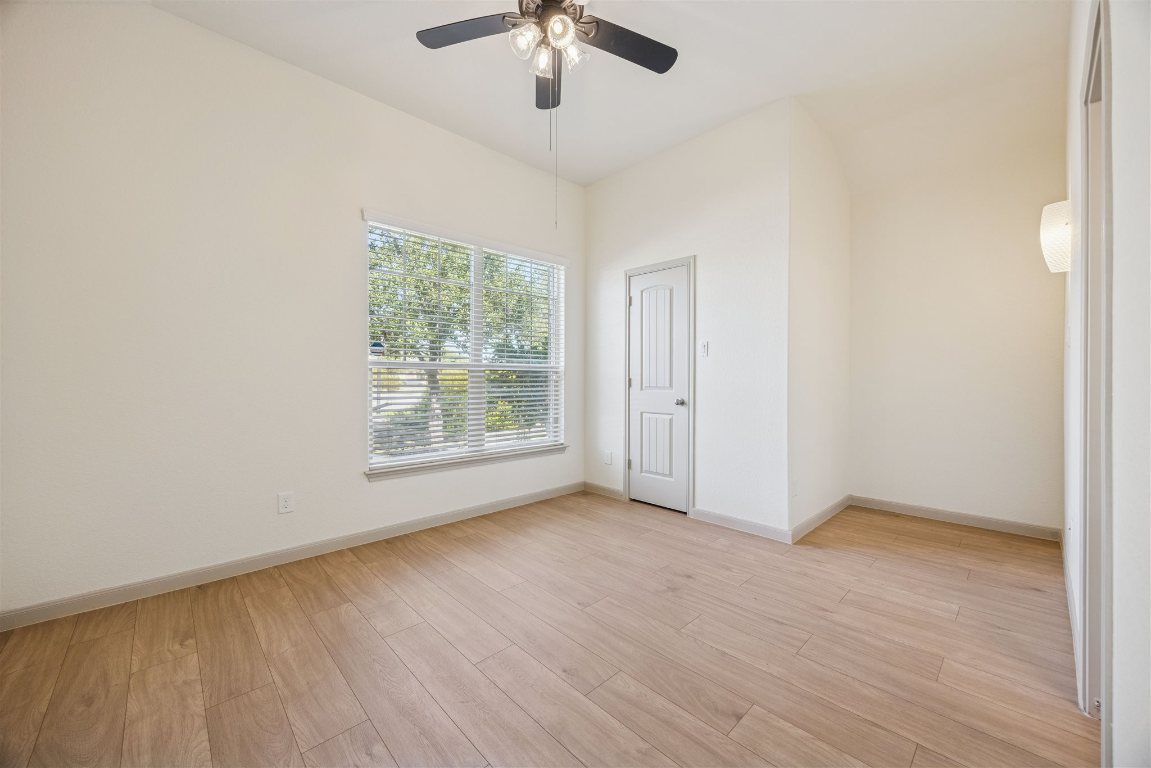 3329 Eagle Ridge Lane Pflugerville, TX 78660 - Photo 21 of 35 Spare room with light wood-style floors and a ceiling fan