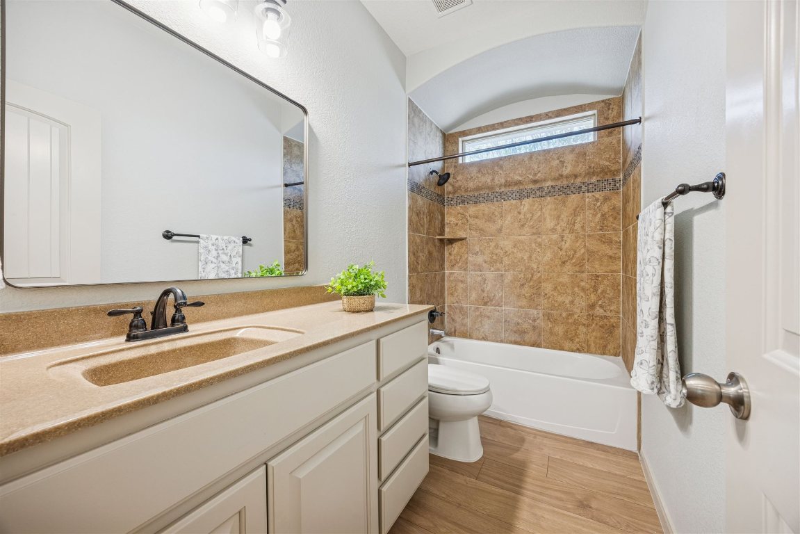 3329 Eagle Ridge Lane Pflugerville, TX 78660 - Photo 23 of 35 Bathroom with vanity, light wood-type flooring, and bathtub / shower combination