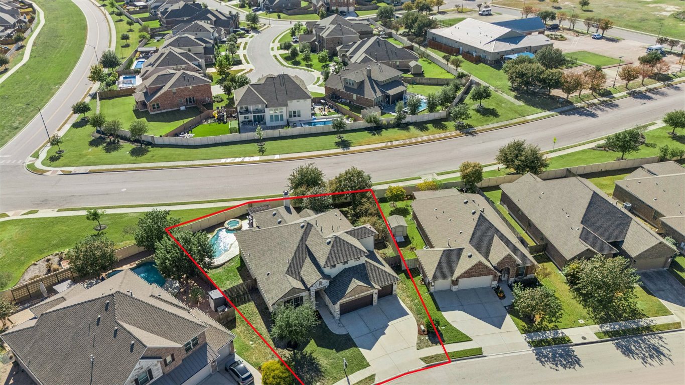 3329 Eagle Ridge Lane Pflugerville, TX 78660 - Photo 35 of 35 Aerial perspective of suburban area featuring property parcel outlined