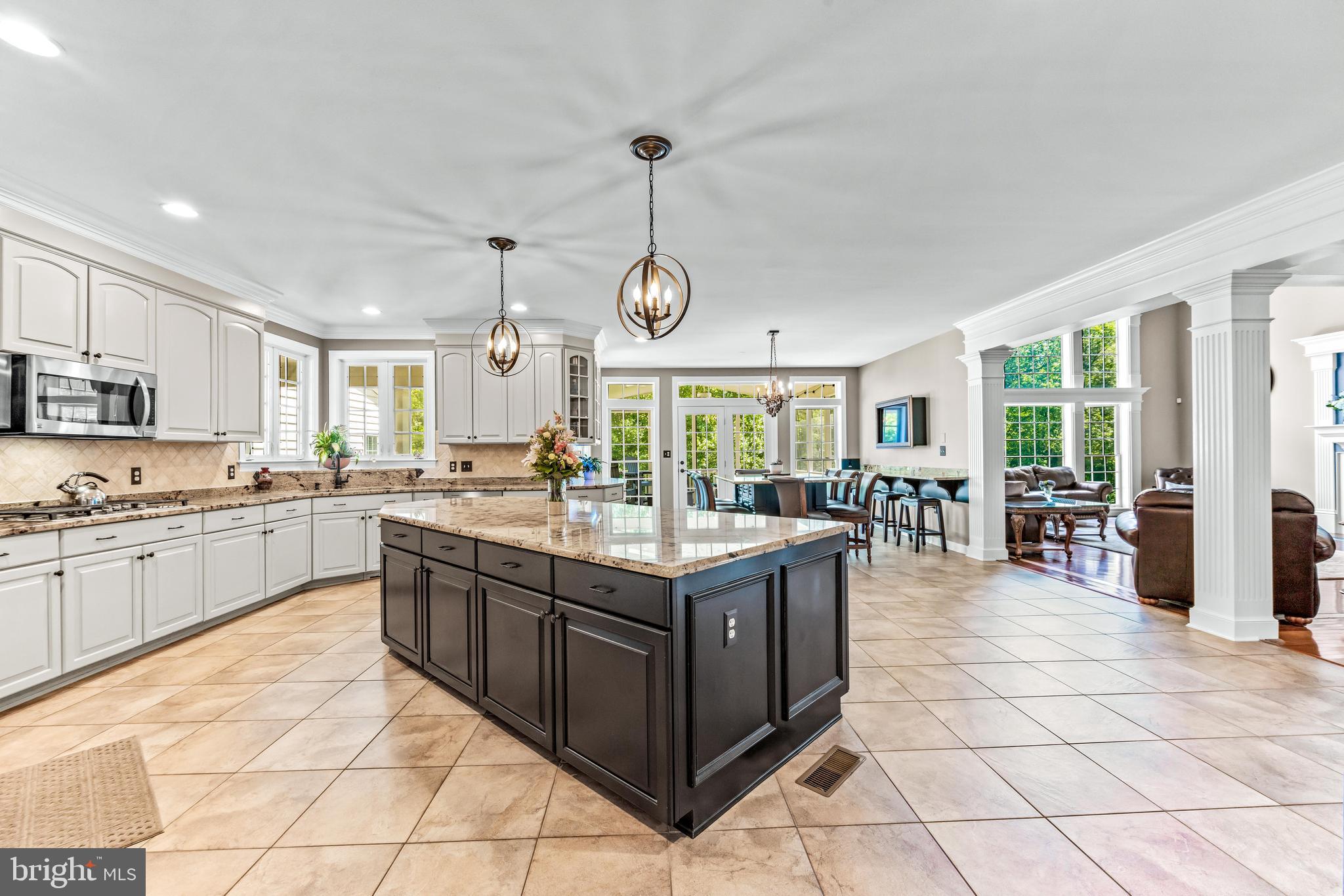 1703 Lake Forest Drive Finksburg, MD 21048 - Photo 16 of 82 a kitchen with stainless steel appliances granite countertop a stove and a sink