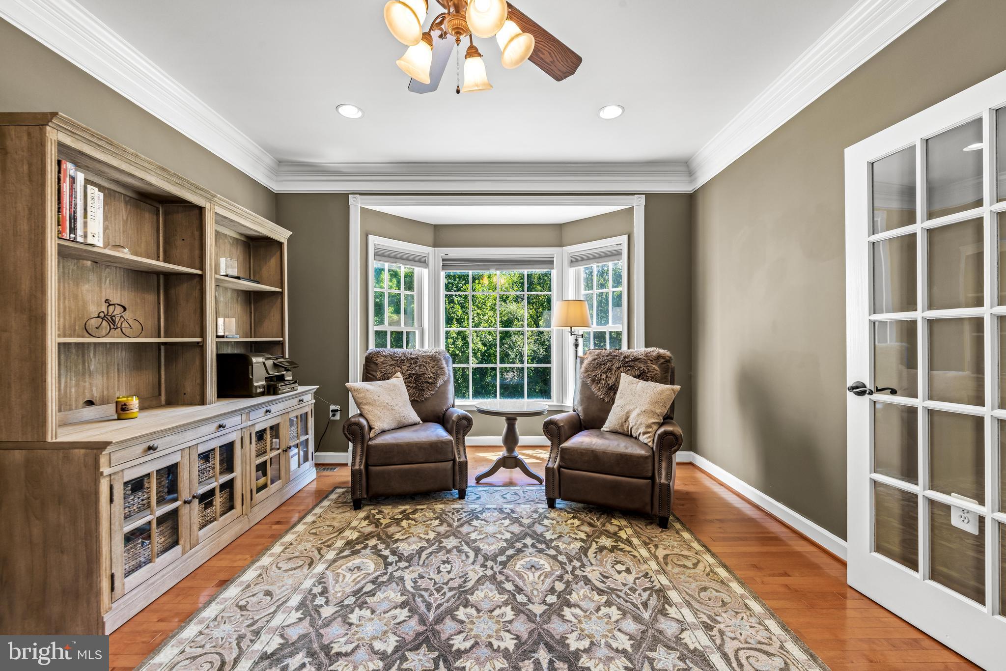 1703 Lake Forest Drive Finksburg, MD 21048 - Photo 26 of 82 a living room with furniture hardwood floor and a rug