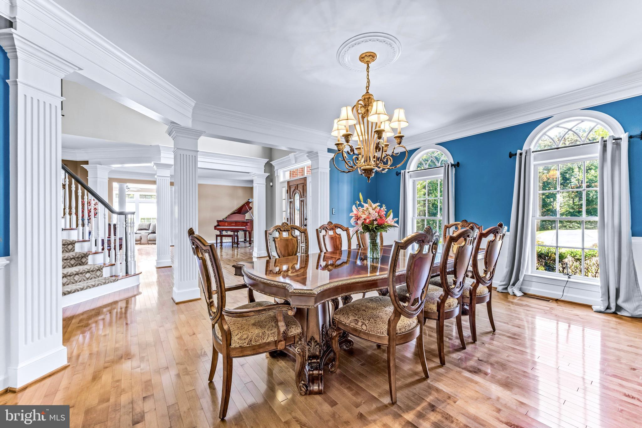 1703 Lake Forest Drive Finksburg, MD 21048 - Photo 30 of 82 a view of a dining room with furniture a chandelier and wooden floor