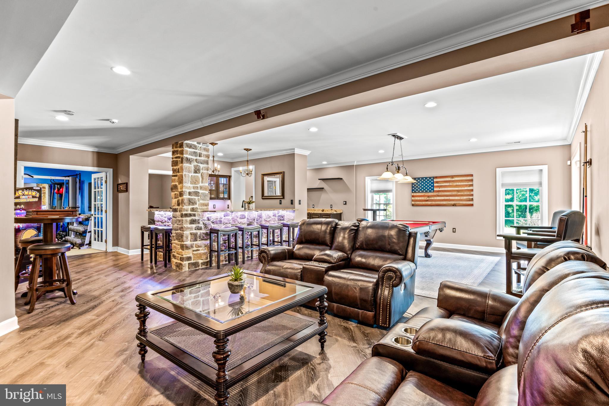 1703 Lake Forest Drive Finksburg, MD 21048 - Photo 51 of 82 a living room with furniture a table and a large window