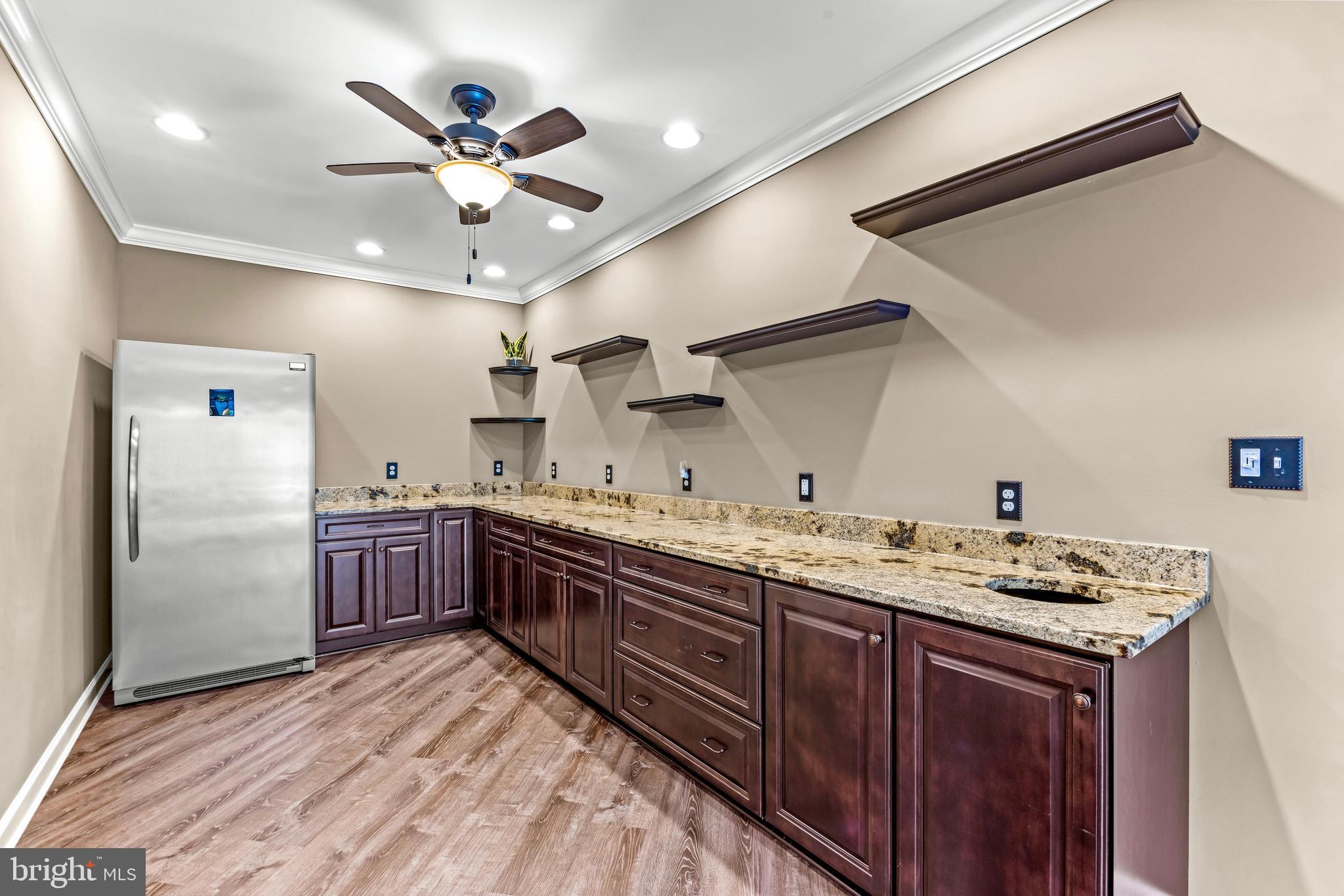 1703 Lake Forest Drive Finksburg, MD 21048 - Photo 58 of 82 a kitchen with a sink stainless steel appliances and cabinets