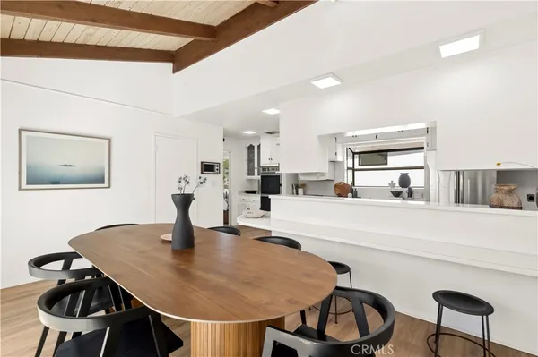 a kitchen with a table chairs and a stove