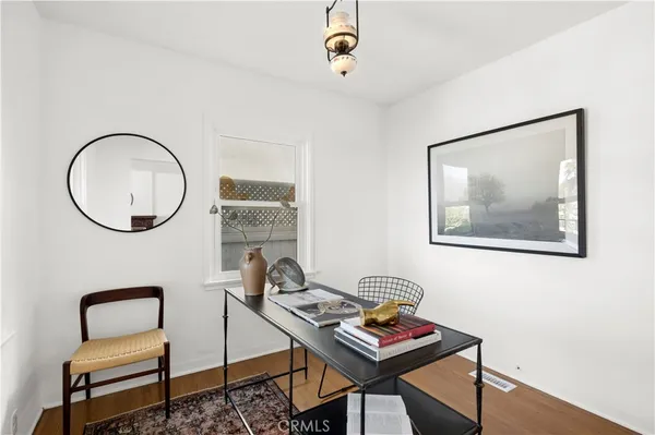 a view of a workspace with furniture
