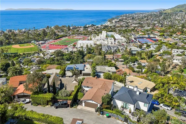an aerial view of residential houses with outdoor space