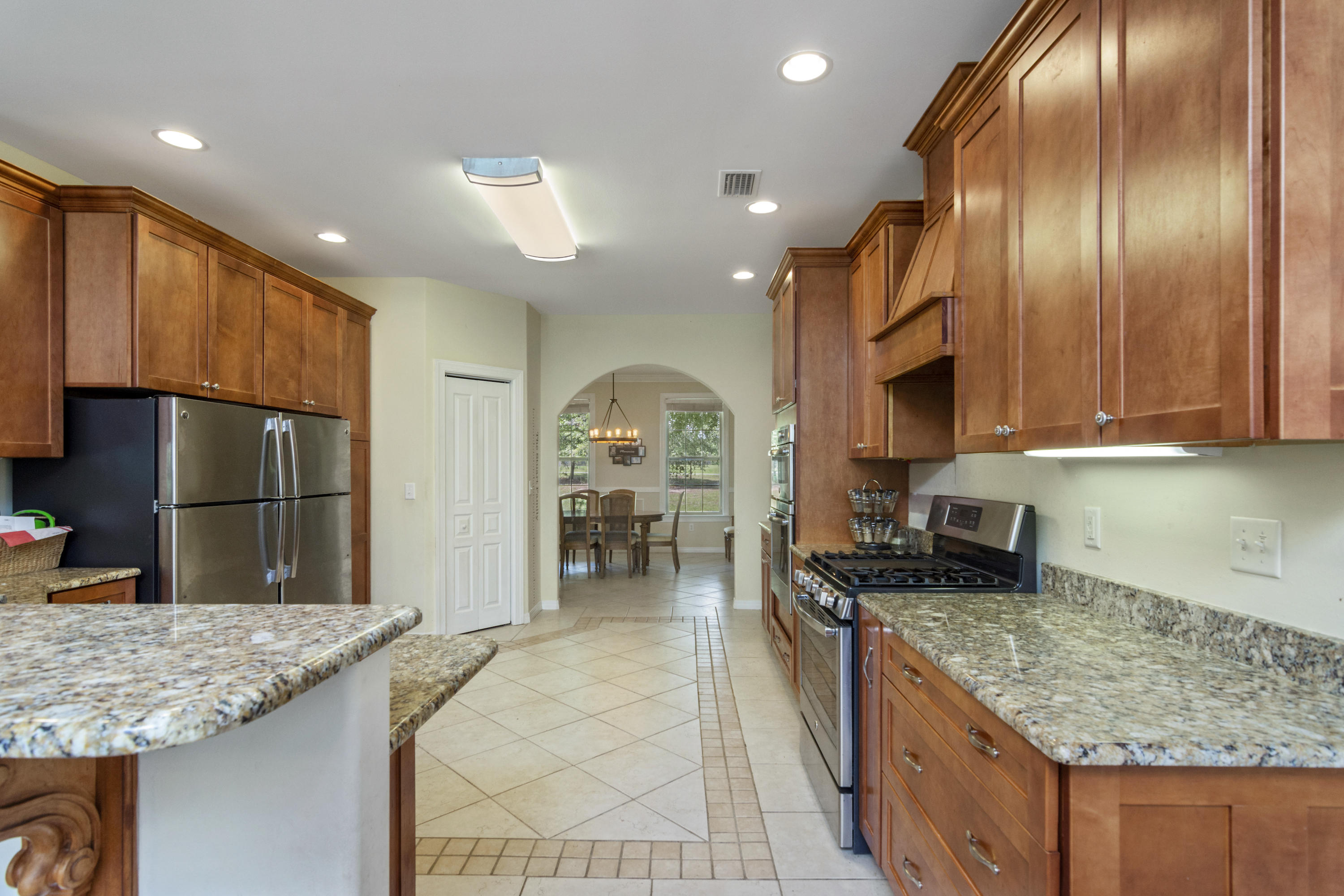 960 Long Road DeFuniak Springs, FL 32433 - Photo 2 of 38 a kitchen with stainless steel appliances granite countertop a sink stove and refrigerator