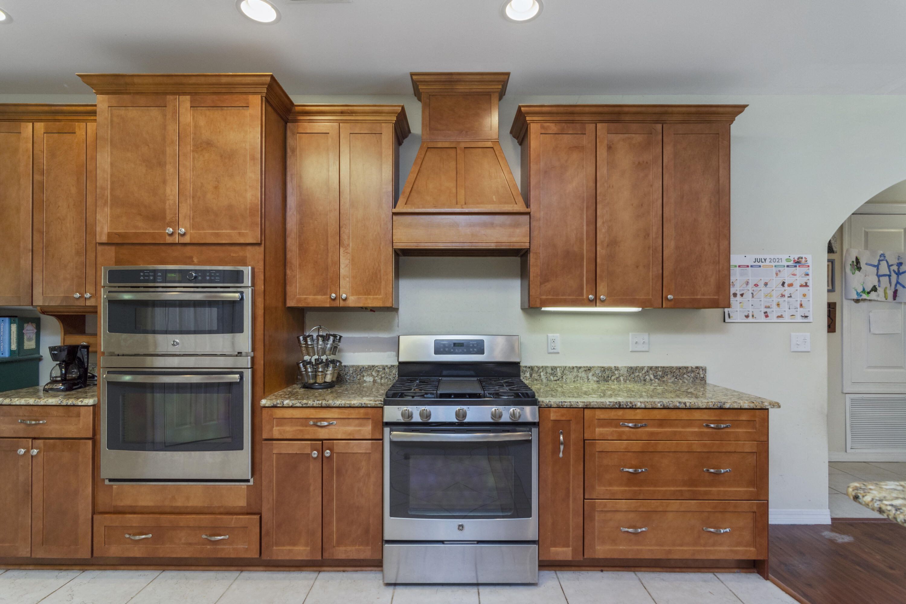 960 Long Road DeFuniak Springs, FL 32433 - Photo 3 of 38 a kitchen with granite countertop wooden cabinets and stainless steel appliances