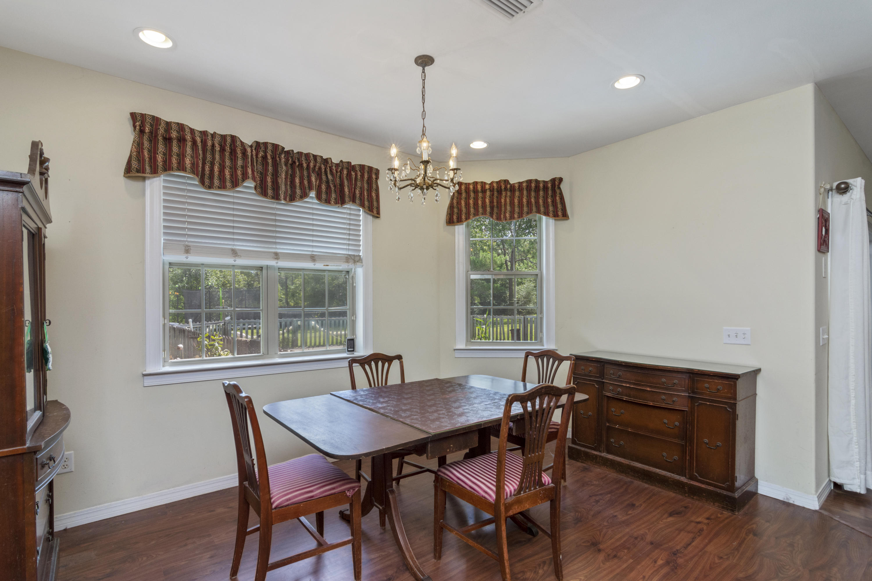 960 Long Road DeFuniak Springs, FL 32433 - Photo 7 of 38 a view of a dining room with furniture window and outside view