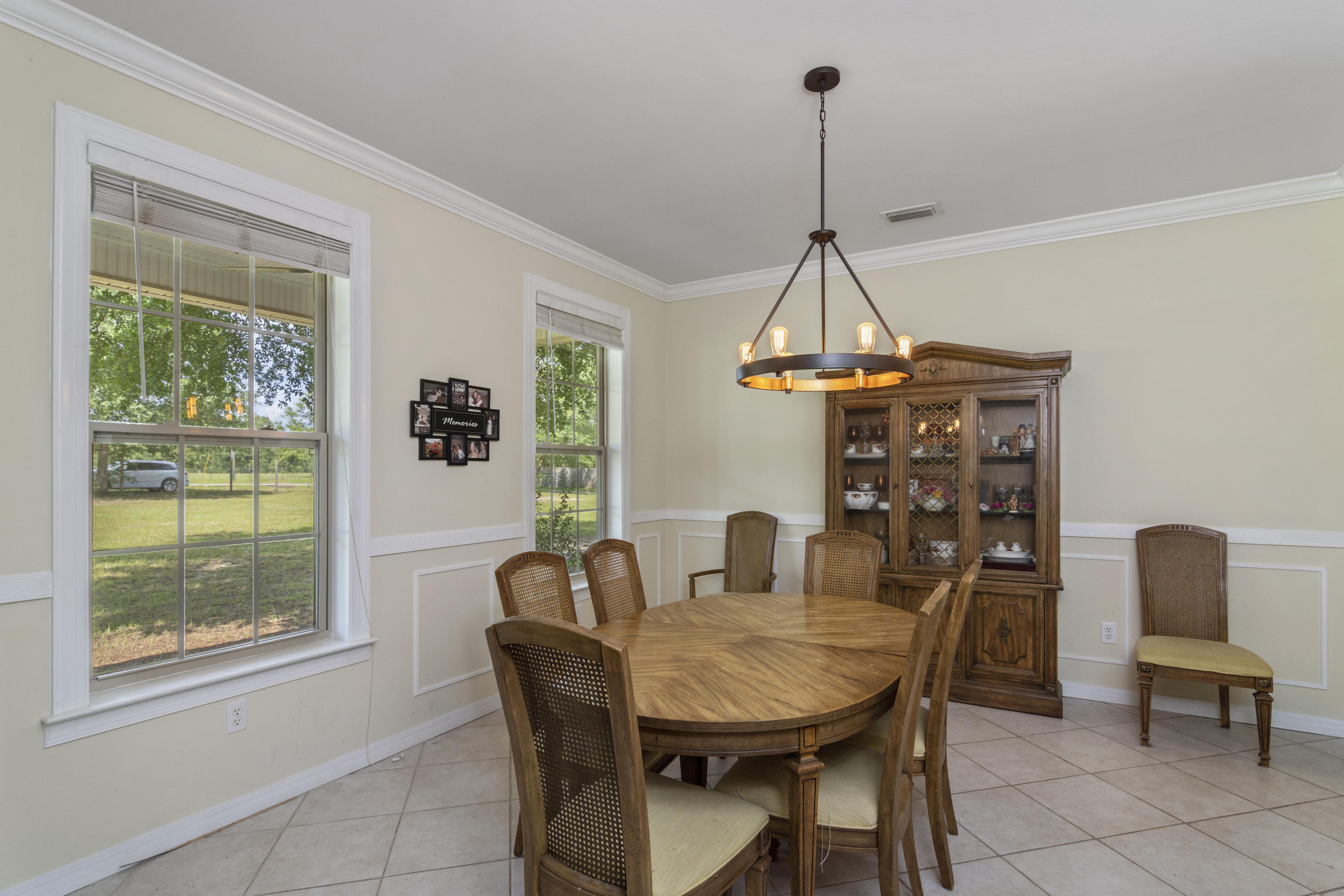 960 Long Road DeFuniak Springs, FL 32433 - Photo 8 of 38 a view of a dining room with furniture window and outside view