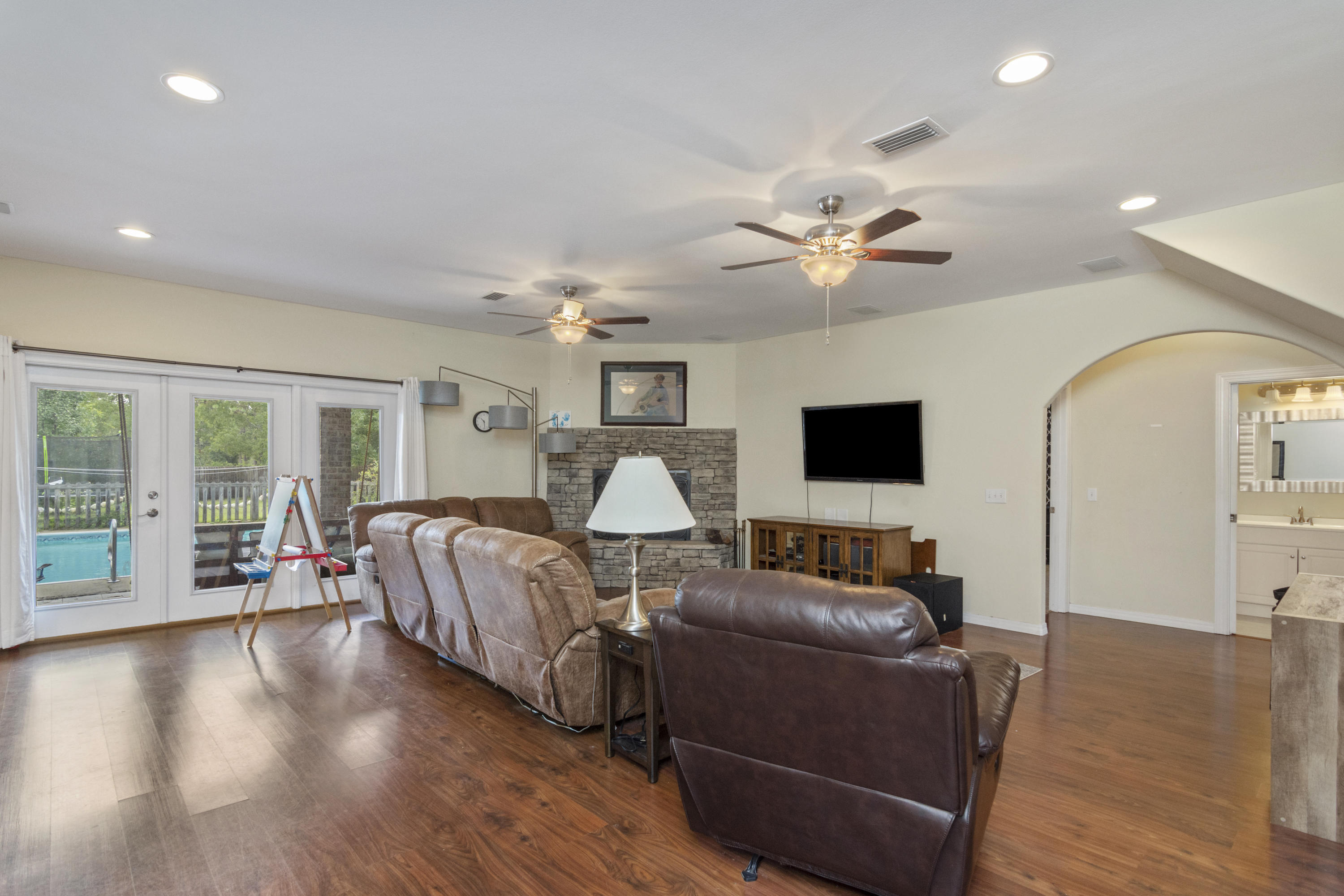 960 Long Road DeFuniak Springs, FL 32433 - Photo 9 of 38 a living room with furniture and a flat screen tv with wooden floor