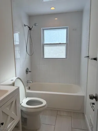 a bathroom with a toilet sink and bathtub
