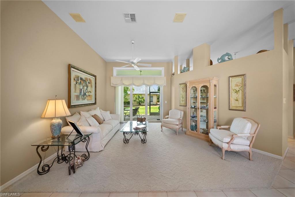 3971 Spring Garden Lane Estero, FL 33928 - Photo 22 of 31 a living room with furniture and a window