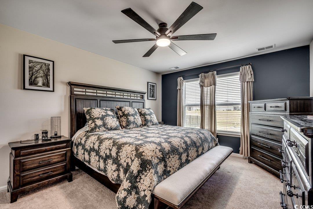 777 Woodland Farms Circle Aynor, SC 29511 - Photo 14 of 31 Bedroom with baseboards, visible vents, and light colored carpet