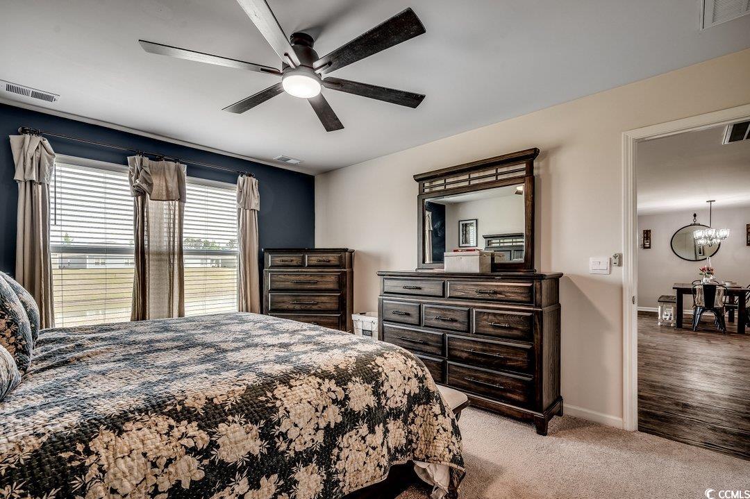 777 Woodland Farms Circle Aynor, SC 29511 - Photo 15 of 31 Bedroom featuring visible vents, light carpet, and baseboards