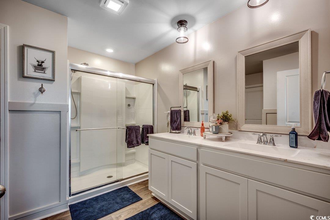 777 Woodland Farms Circle Aynor, SC 29511 - Photo 16 of 31 Full bath with double vanity, wood finished floors, a shower stall, and a sink