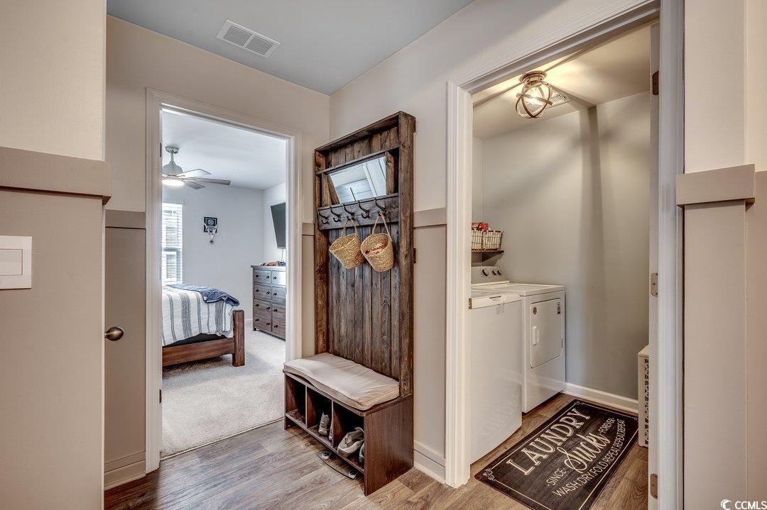 777 Woodland Farms Circle Aynor, SC 29511 - Photo 19 of 31 Mudroom with visible vents, wood finished floors, a ceiling fan, and separate washer and dryer