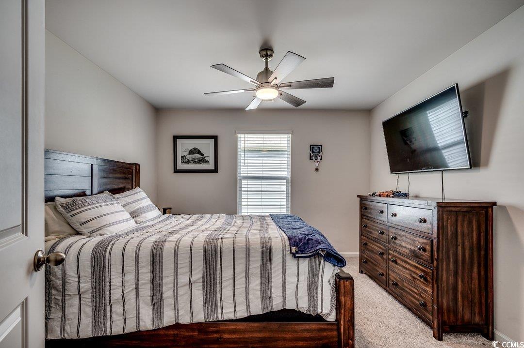 777 Woodland Farms Circle Aynor, SC 29511 - Photo 21 of 31 Bedroom with baseboards, a ceiling fan, and light colored carpet