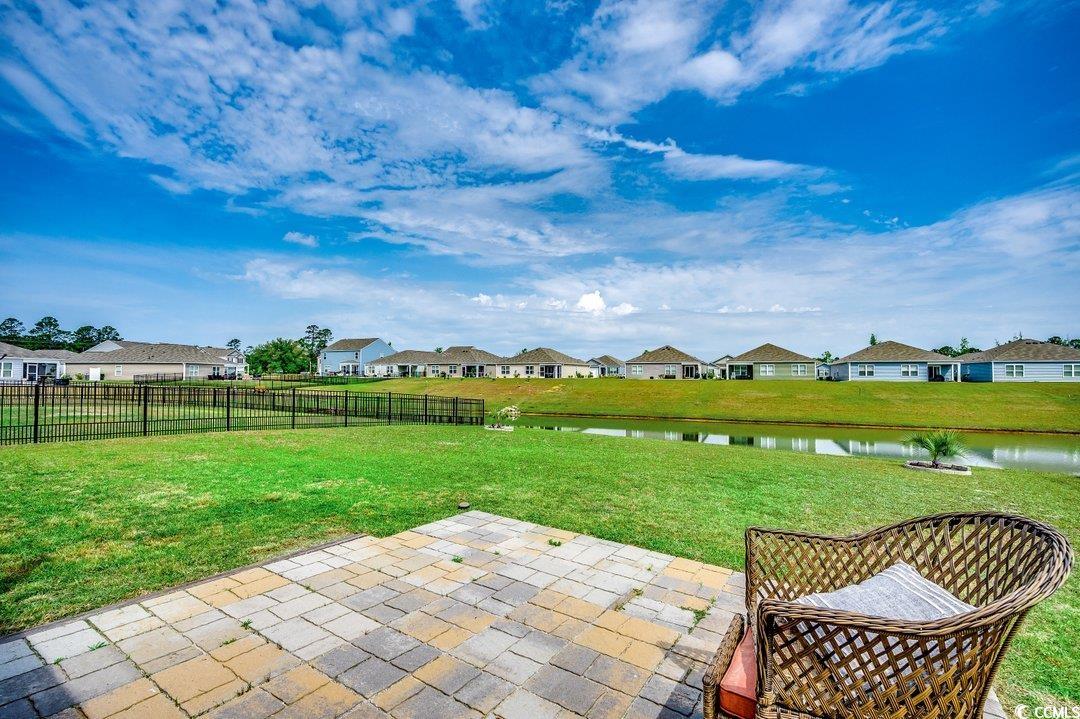 777 Woodland Farms Circle Aynor, SC 29511 - Photo 25 of 31 View of yard featuring a patio, fence, a residential view, and a water view