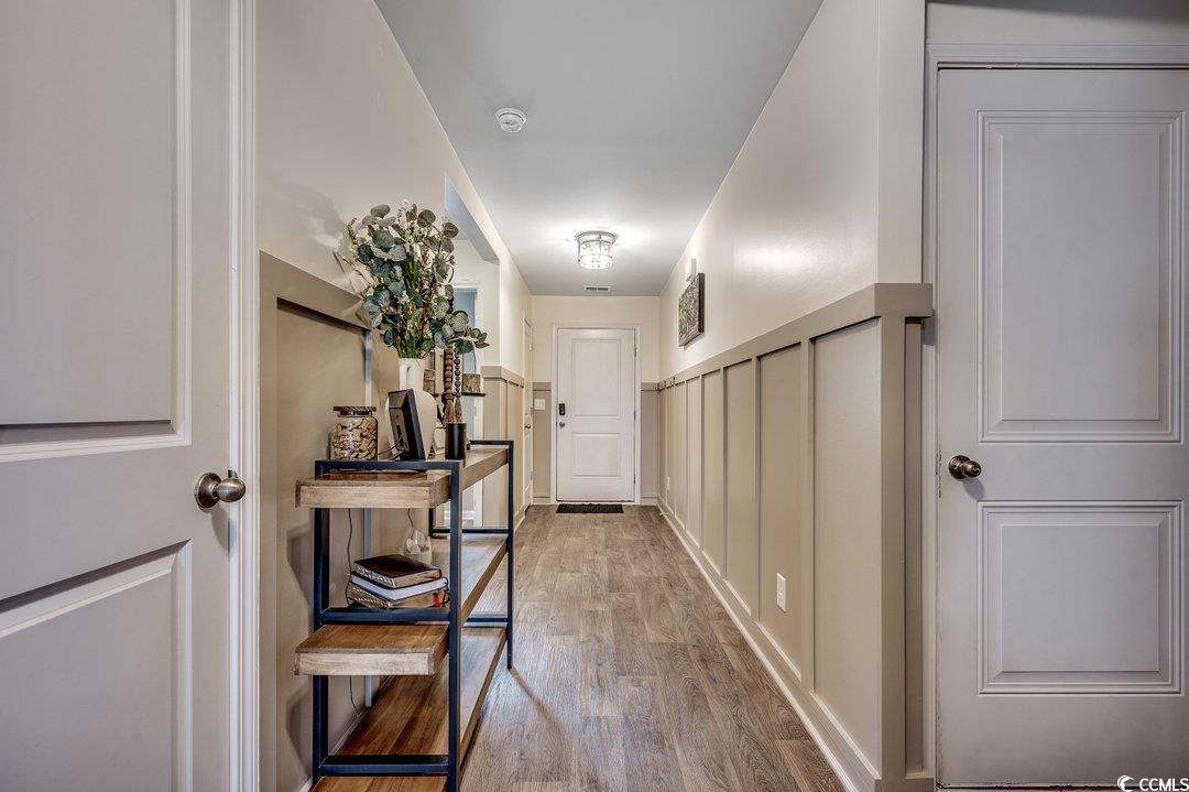 777 Woodland Farms Circle Aynor, SC 29511 - Photo 26 of 31 Corridor with wood finished floors and a decorative wall