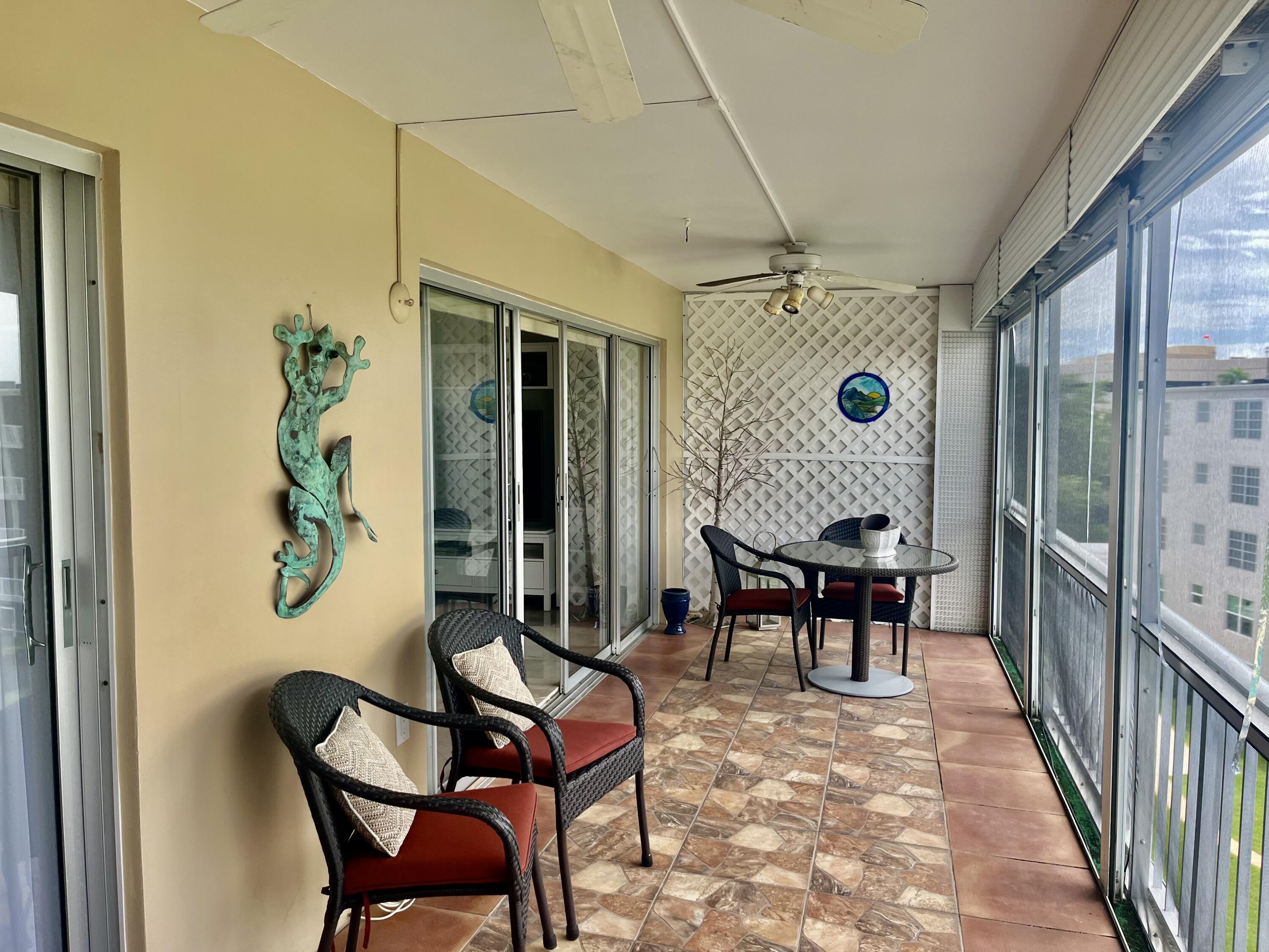 145 Atlantis Boulevard, Unit PH4 Atlantis, FL 33462 - Photo 18 of 27 a view of a livingroom with furniture and a window
