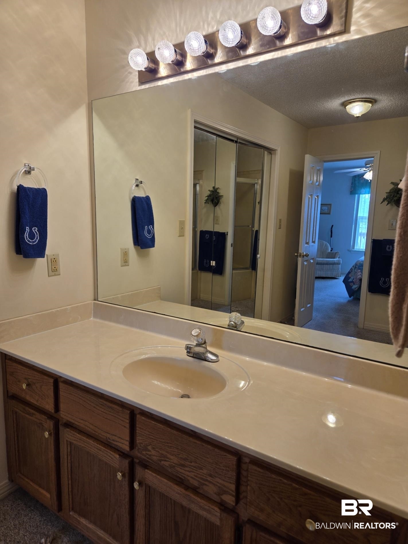 3200 Loop Road, Unit 87 Orange Beach, AL 36561 - Photo 28 of 46 Bathroom with vanity, a textured ceiling, and ceiling fan
