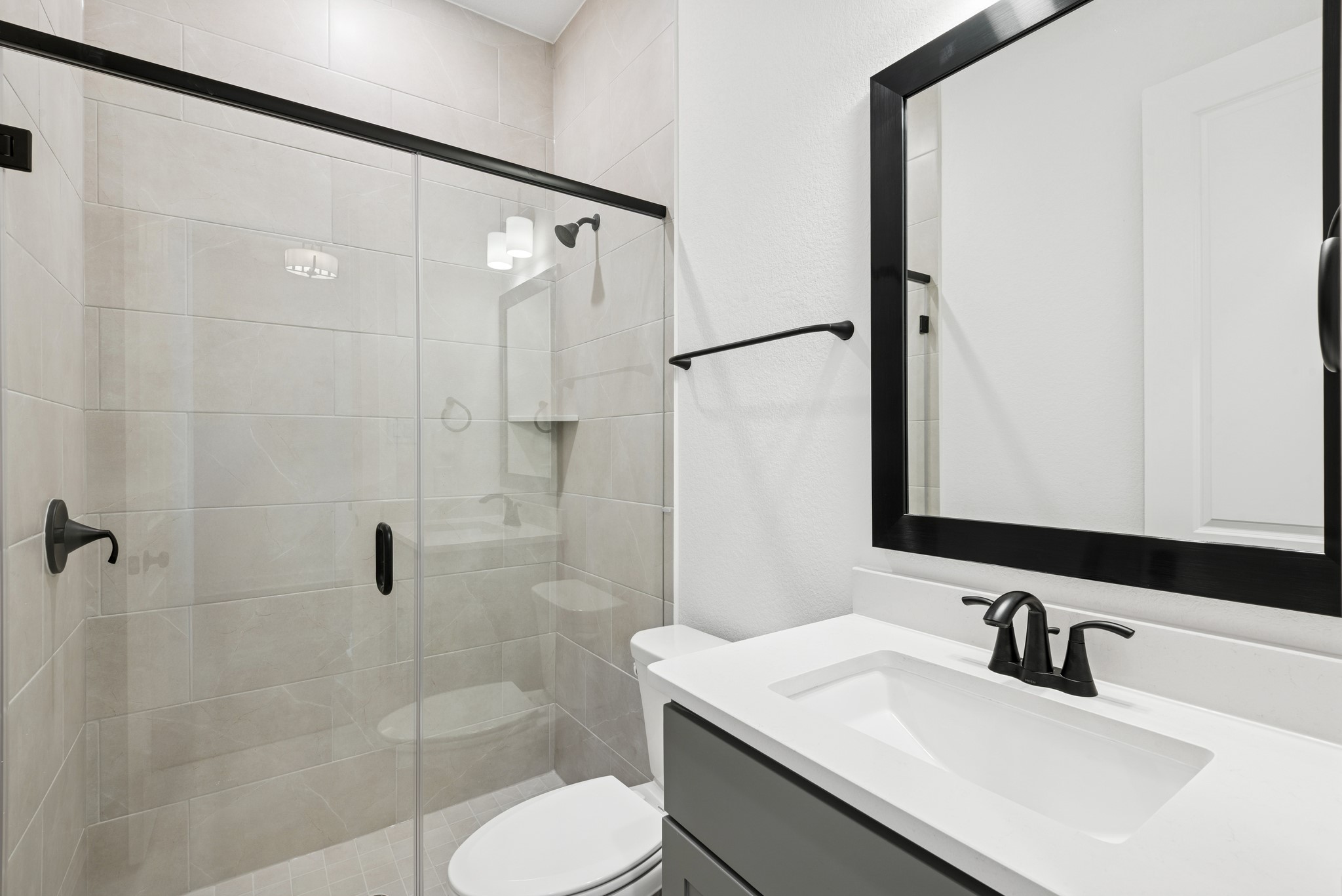 15714 Terracotta Terrace Lane Conroe, TX 77302 - Photo 15 of 47 a bathroom with a sink toilet and shower
