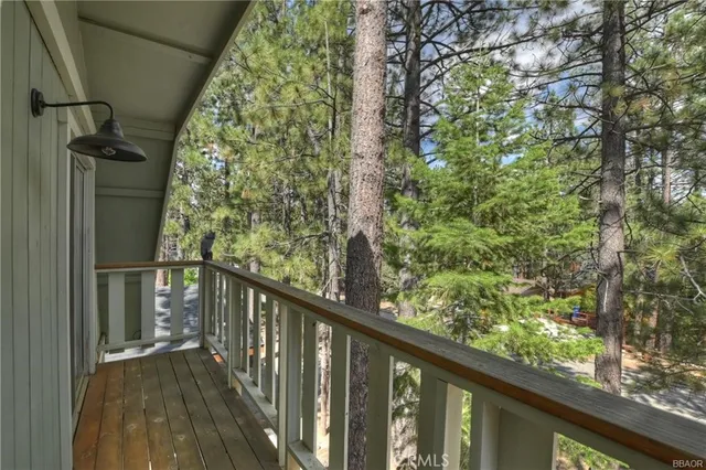 a view of balcony with wooden floor