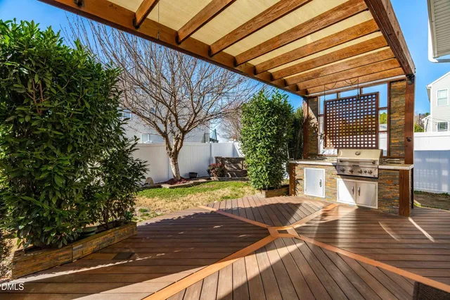 a view of outdoor space with wooden floor and seating space