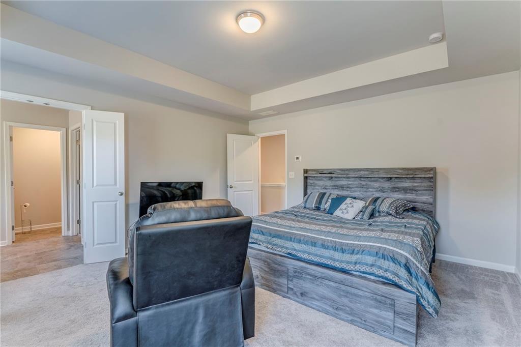 122 Old Mill Drive Calhoun, GA 30701 - Photo 14 of 25 a bedroom with a bed and a couch